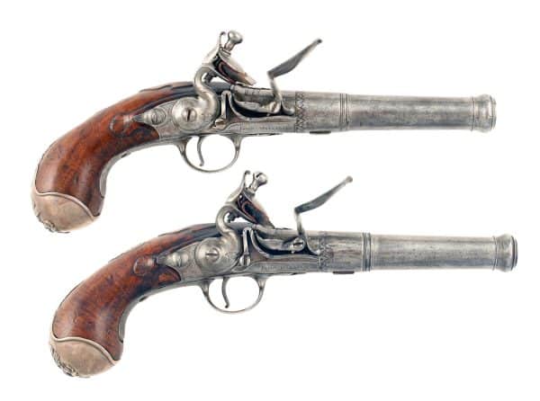 A Pair of Silver Mounted Flintlock Queen Anne Pistols by John Williams, Circa 1720.